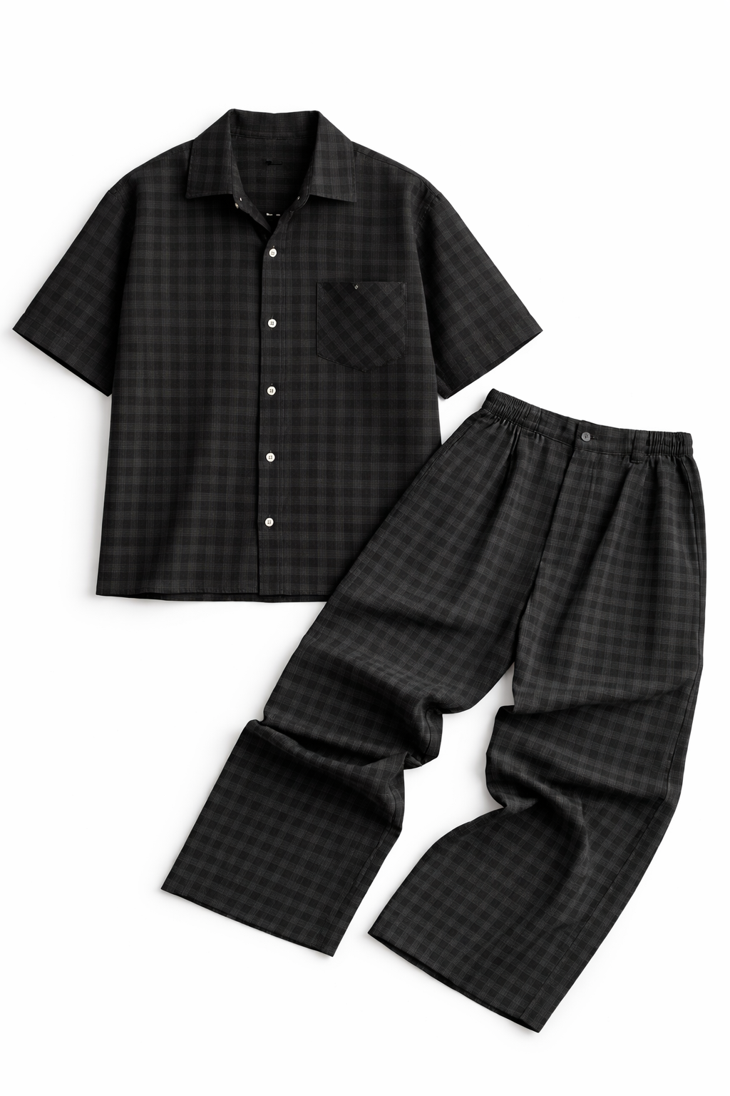 Black checkered shirt and pants set on a white background
