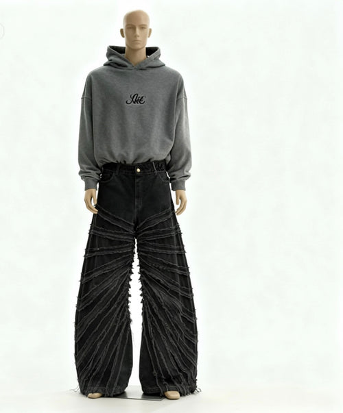 Mannequin wearing a gray hoodie with text and black pleated pants on a white background