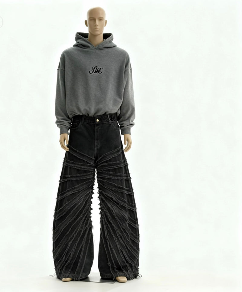 Mannequin wearing a gray hoodie with text and black pleated pants on a white background